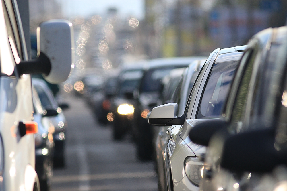 How to Avoid Distracted Driving - traffic on the road in a European city, stopping vehicular traffic, stop cars