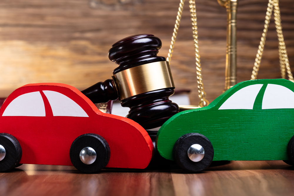 How to Speak with an Insurance Company After an Accident - Two Green And Red Wooden Cars